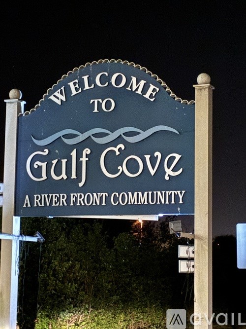 A sign welcoming people to Gulf Cove, a river front community.