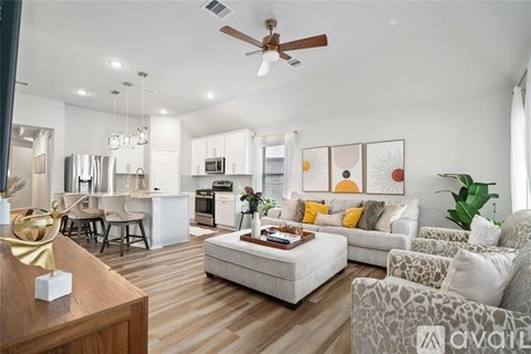 A modern living room with a white couch and a coffee table.