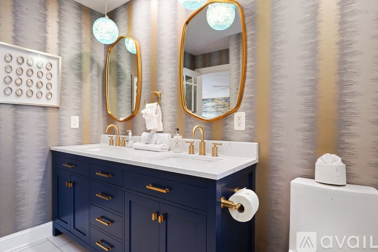 A bathroom with a sink and a mirror.