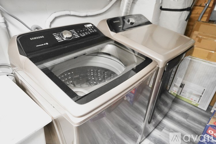 A Samsung washing machine with the door open.
