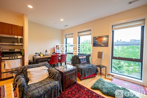 A living room with two couches and a table with a lamp.