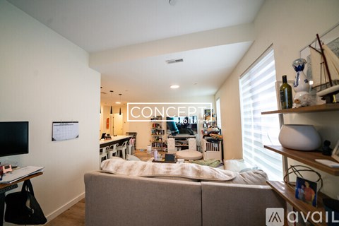 A living room with a couch and a television.