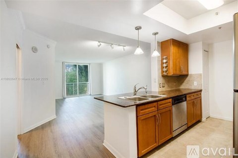 A kitchen with wooden cabinets and a white countertop.