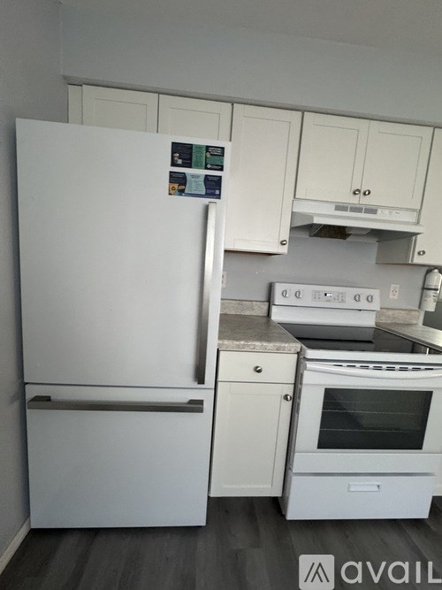 A white fridge and oven in a kitchen.
