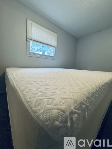 A room with two chairs and a desk with a computer.