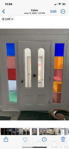 A white door with a glass panel and a handle.