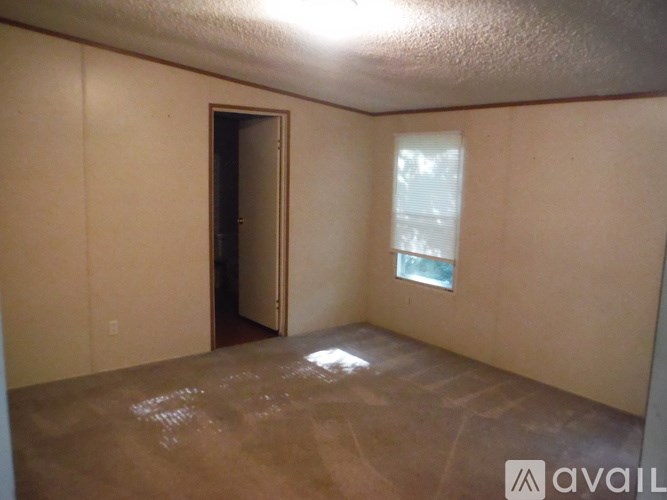 A room with a door and a window.