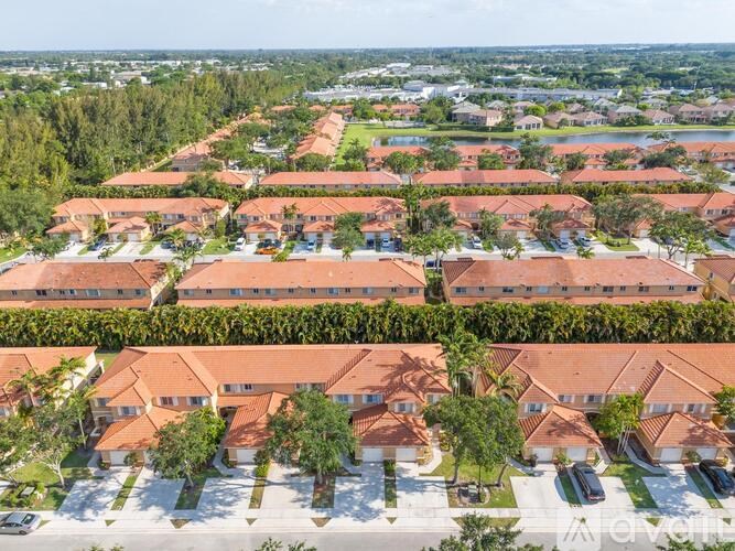 A bird's eye view of a residential area with houses and trees.