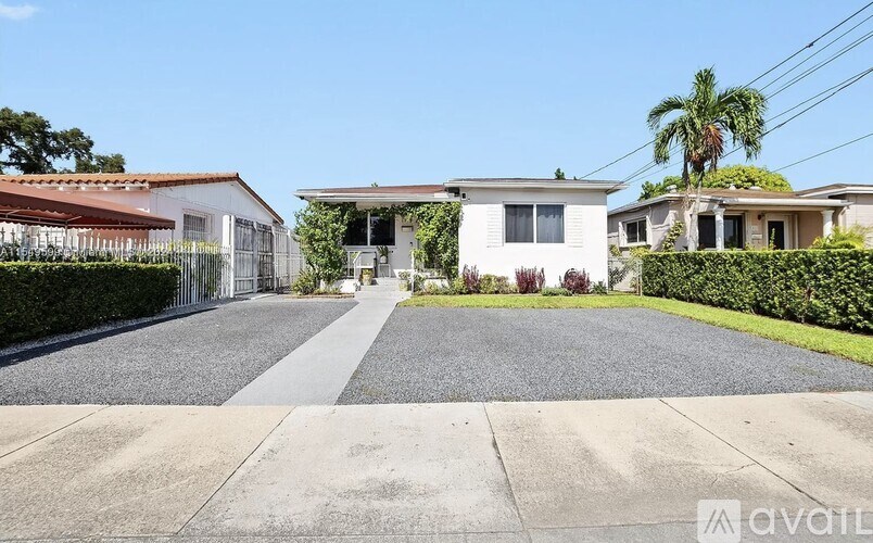 A house with a driveway in front of it.