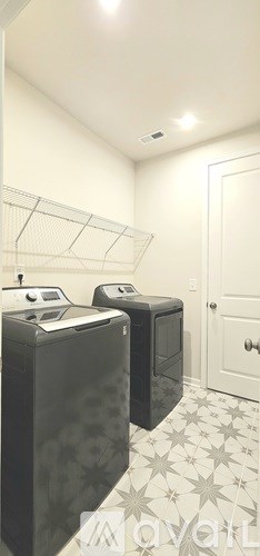 A room with a white ceiling and a white door.