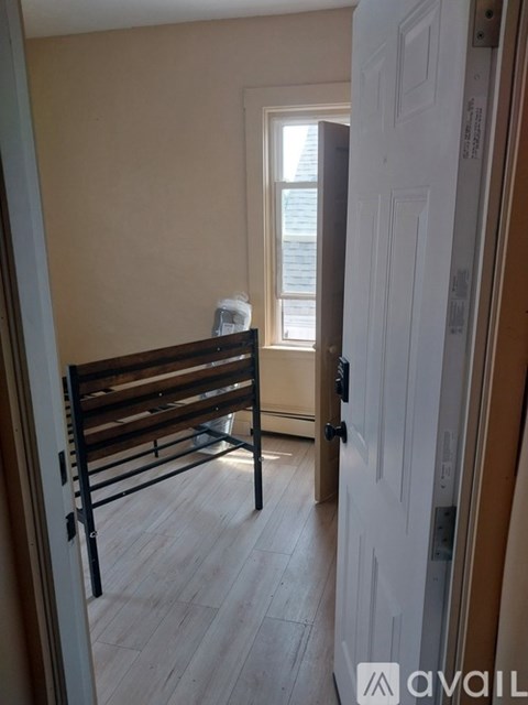A room with a bed and a window.