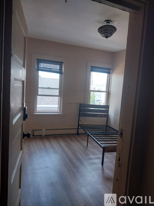 A room with a bed and a window.