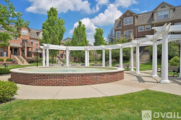 A white pergola is over a hot tub in a grassy area.