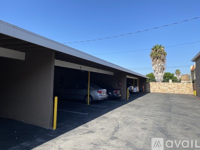 A parking garage with cars parked in it.