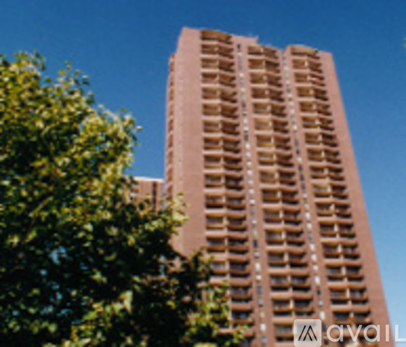 A tall building with a lot of windows and balconies.