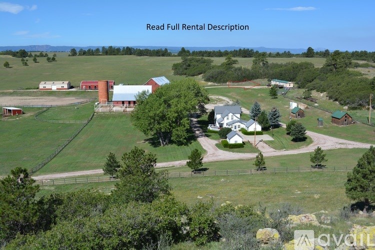 A farm with a red barn and a white house is for rent.