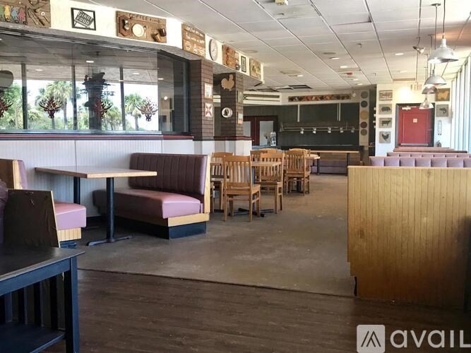 A restaurant with wooden booths and tables.