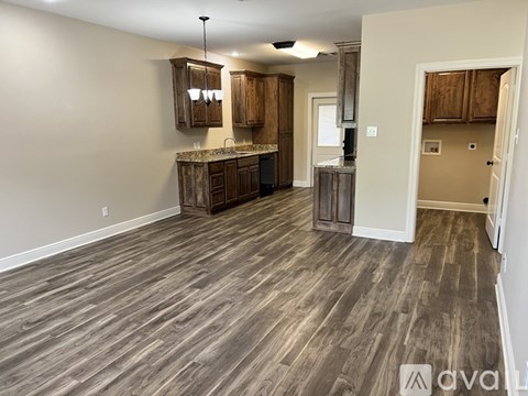 A kitchen with wooden cabinets and a countertop.