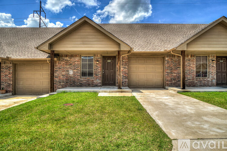 A house with a brown garage door is for sale.