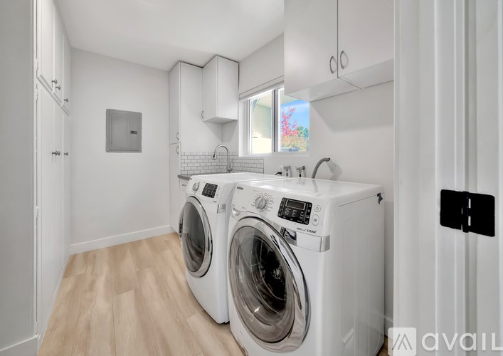 A laundry room with a washer and dryer.