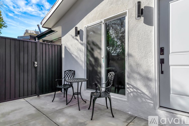 A patio with a table and chairs is shown.