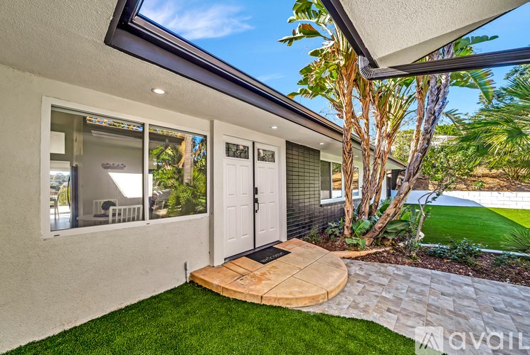 A house with a white door and a glass window.