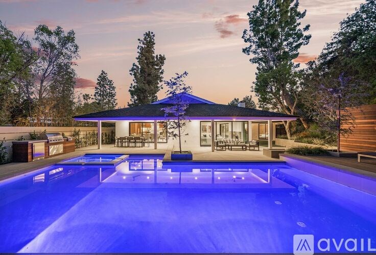 A house with a pool in the backyard.