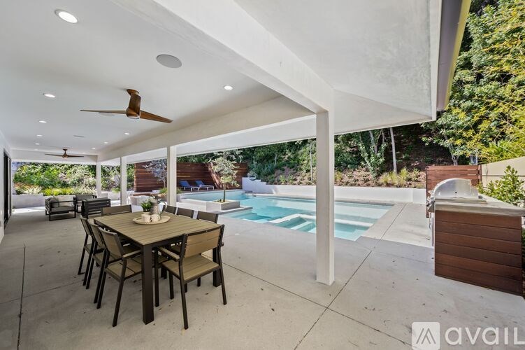 A patio with a table and chairs is available for rent.