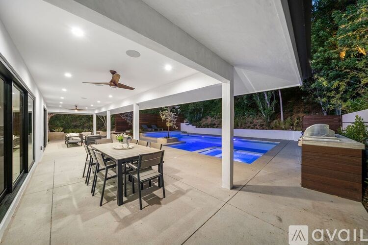 A patio with a table and chairs is available for rent.