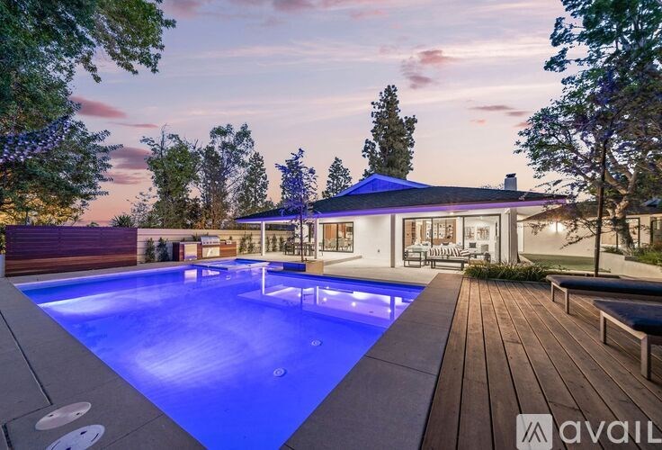 A pool with a blue light in the middle of it.