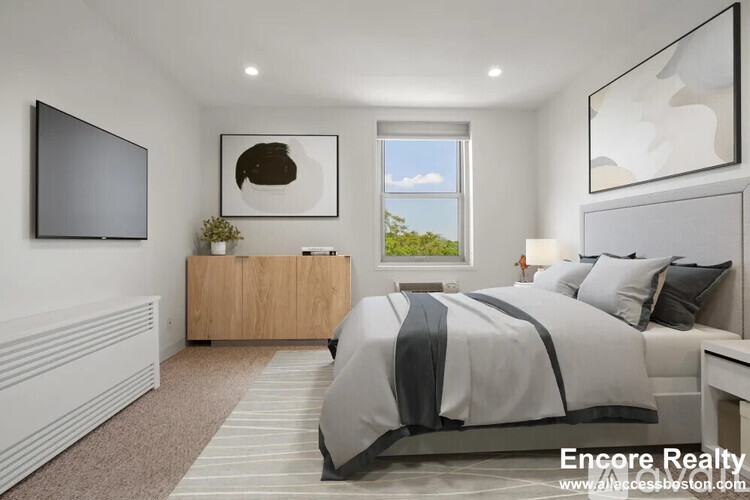 A modern bedroom with a large bed and a flat screen TV.