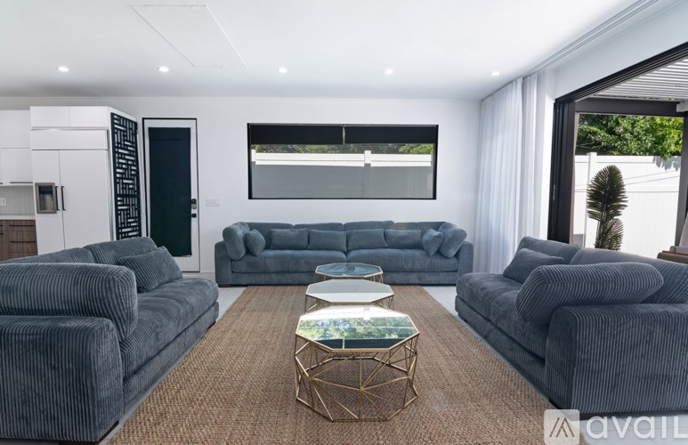 A modern living room with grey sofas and a coffee table.