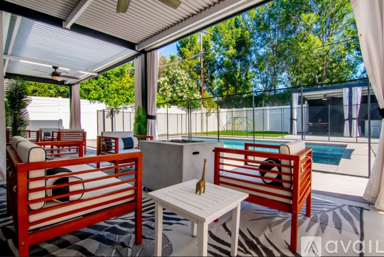 A patio with a table and chairs is available for rent.