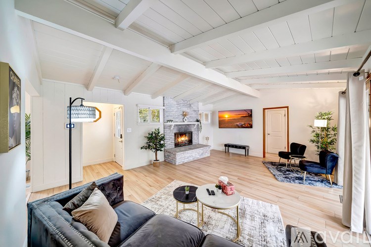 A living room with a fireplace and a couch.