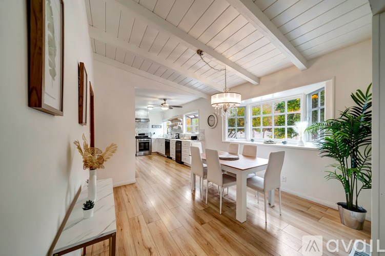 A dining room with a table and chairs is shown.