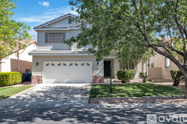 A house with a white garage door is for sale.