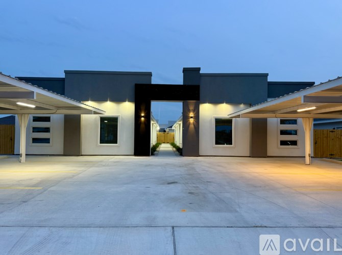 A modern building with a large entrance and a flat roof.