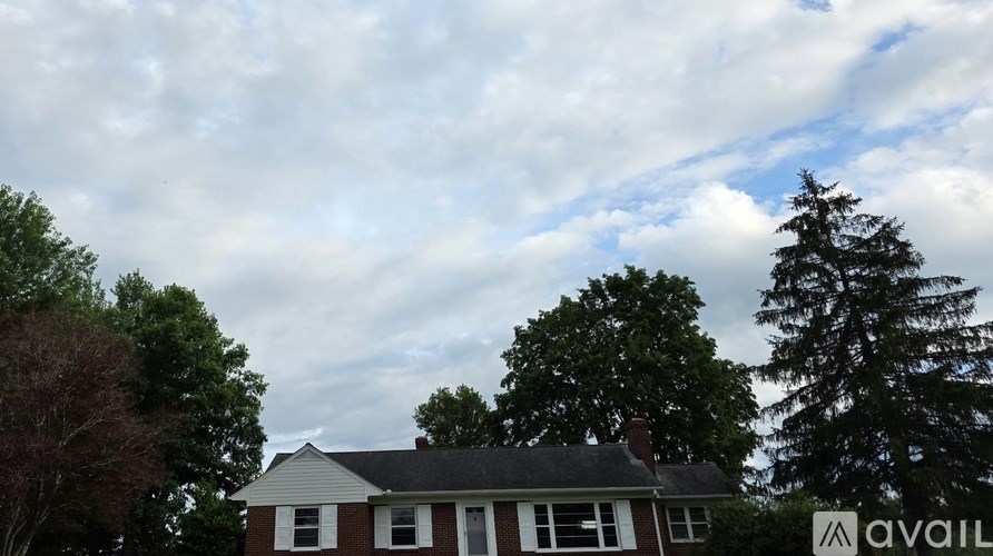 A house with a sign that says "available" in front of it.