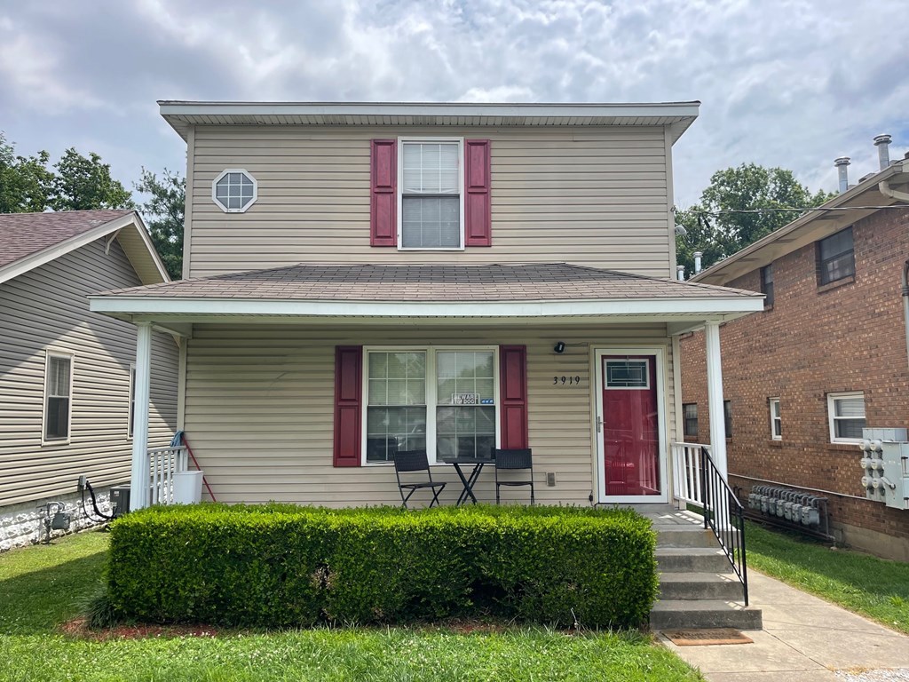 A house with a red door and windows.