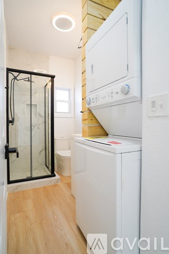 A white oven and dishwasher in a modern kitchen.