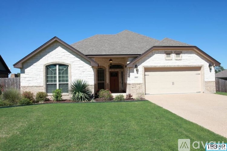 A house with a garage and a driveway.