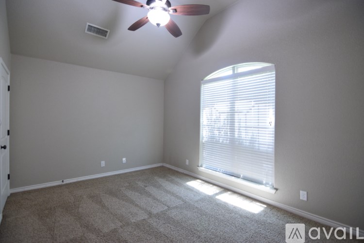 A bathroom with a large mirror above a double sink vanity.