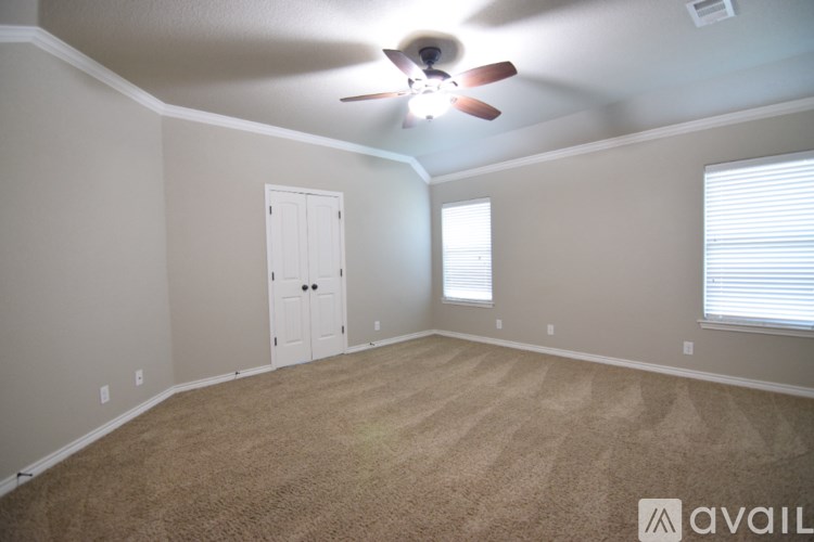 A living room with a fireplace and a television.