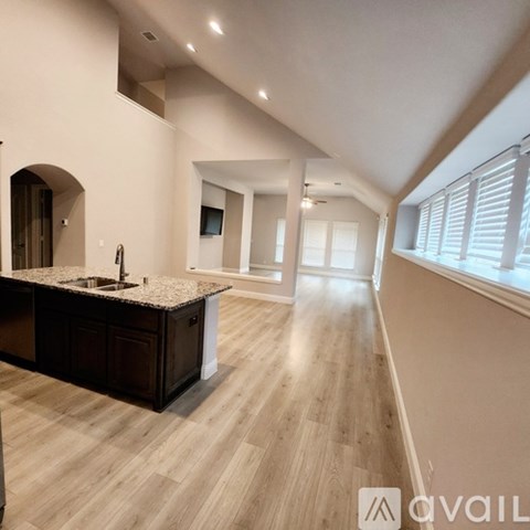 A modern kitchen with a sink and a countertop.