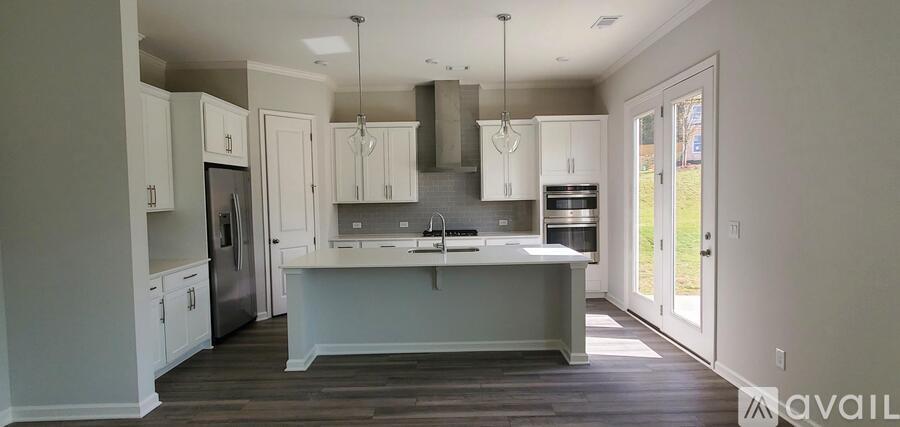 A kitchen with a large island in the middle.