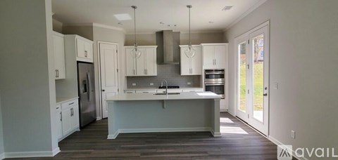 A kitchen with a large island in the middle.