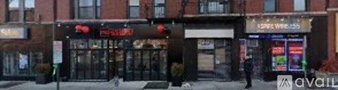 A street view of a city with a red sign that says "Pizza Express".