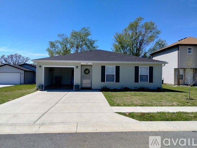A house with a garage is available for rent.