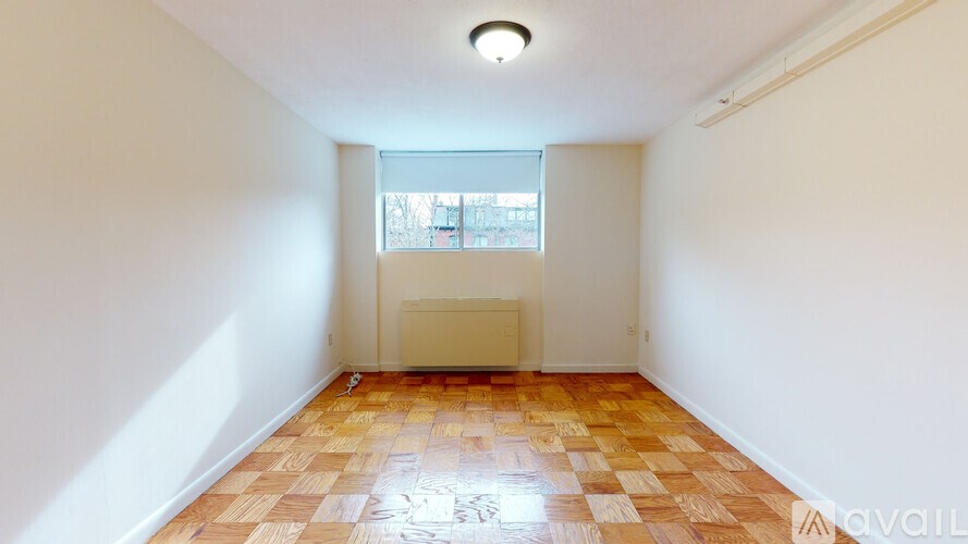 A room with a tiled floor and a window.