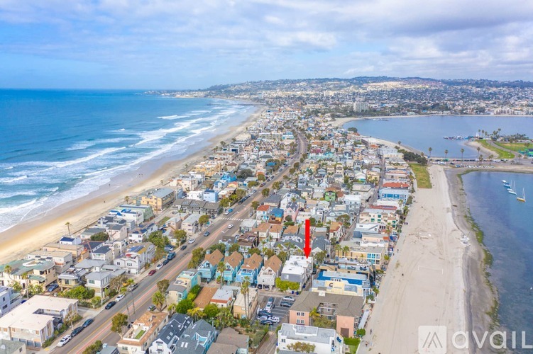 A beachfront city with a long stretch of sandy beach.